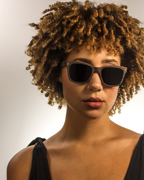 Calexico Polarized Square Walnut Wood Sunglasses worn by a customer model