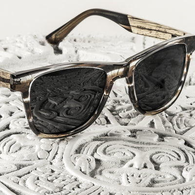 Eagle Peak folded sunglasses view showing plant-based acetate with wood-grain temples temple construction and hinge, Cali Life Co lifetime warranty